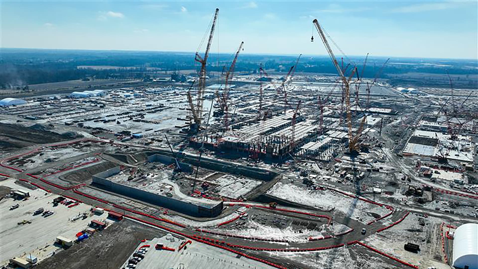 Aerial view of cranes and rising fab structures at Intel's Ohio One construction site in New Albany, Ohio